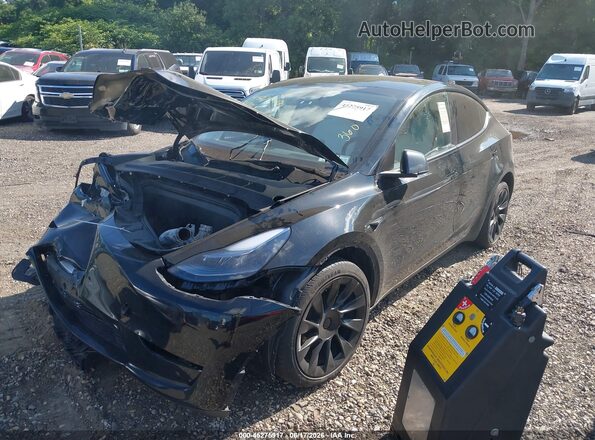 7SAYGDEE8RA219619 2024 TESLA MODEL Y Black Առջևի ձախ երեք քառորդ տեսարան