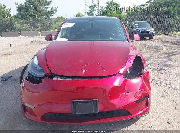 7SAYGDEE8RA275057 2024 TESLA MODEL Y Red Սալոնի հետևի տեսք