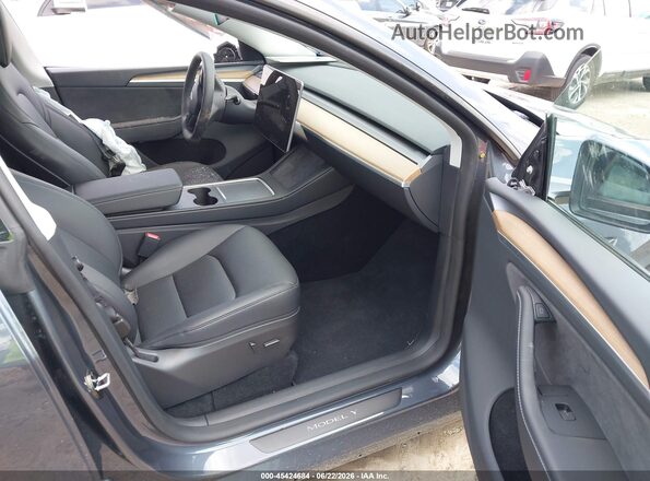 7SAYGDEE9PA162733 2023 TESLA MODEL Y Gray Вид салону спереду
