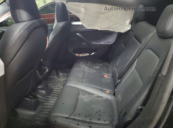 7SAYGDEE9TF402943 2026 TESLA MODEL Black Vista de los asientos traseros