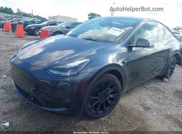 7SAYGDEEXRA231528 2024 TESLA MODEL Y Gray წინა მარცხენა ხედი სამი მეოთხედიდან