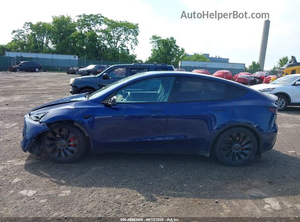 7SAYGDEF3NF464219 2022 TESLA MODEL Y Blue Սալոնի հետևի տեսք