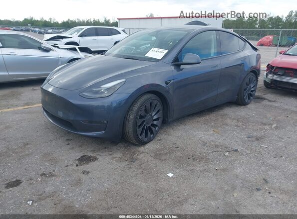 7SAYGDEF4PF861702 2023 TESLA MODEL Y Gray წინა მარცხენა ხედი სამი მეოთხედიდან