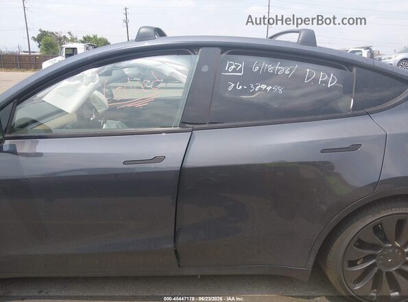 7SAYGDEF5PF880338 2023 TESLA MODEL Y Gray Widok wnętrza z tyłu
