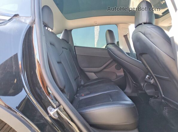 7SAYGDEF7NF407781 2022 TESLA MODEL Black Սալոնի հետևի տեսք