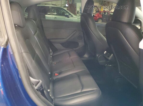 7SAYGDEF7SA342679 2025 TESLA MODEL Blue Rear interior view