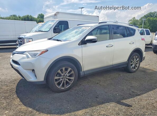 JTMDFREVXGJ054886 2016 TOYOTA RAV4 White 