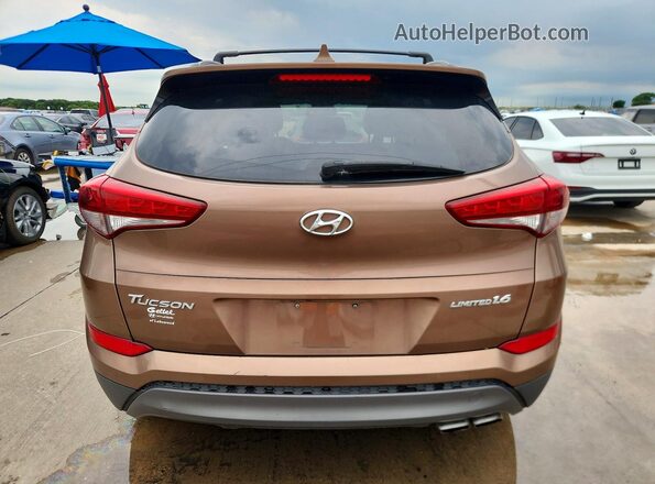 KM8J33A29GU175164 2016 HYUNDAI TUCSON Brown Вид салону спереду