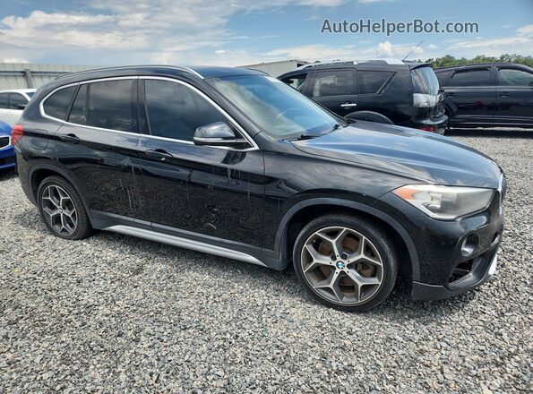 WBXHU7C30J3H43138 2018 BMW X1 Black Vista frontal
