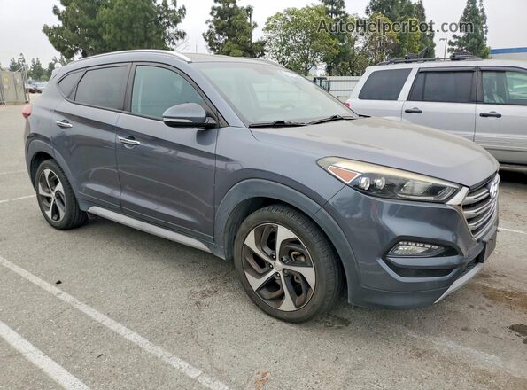 KM8J33A29HU413953 2017 HYUNDAI TUCSON Gray წინა ხედი