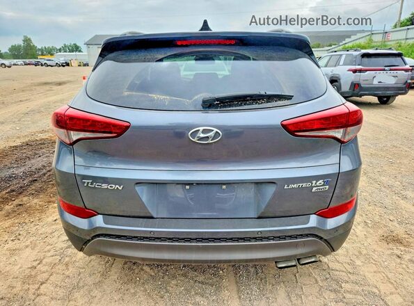 KM8J3CA23GU044036 2016 HYUNDAI TUCSON Gray წინა სალონის ხედი