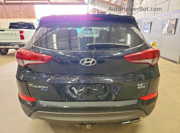 KM8J3CA22GU043878 2016 HYUNDAI TUCSON Черный Вид салона спереди
