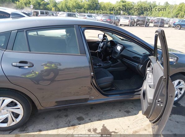 JF1GUABC6R8305636 2024 SUBARU IMPREZA Gray Front interior view