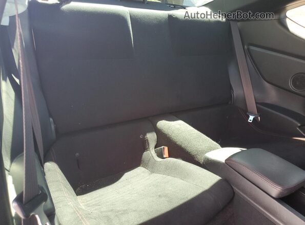 JF1ZNAA11G9701017 2016 TOYOTA SCION Black Հետևի նստատեղերի տեսք