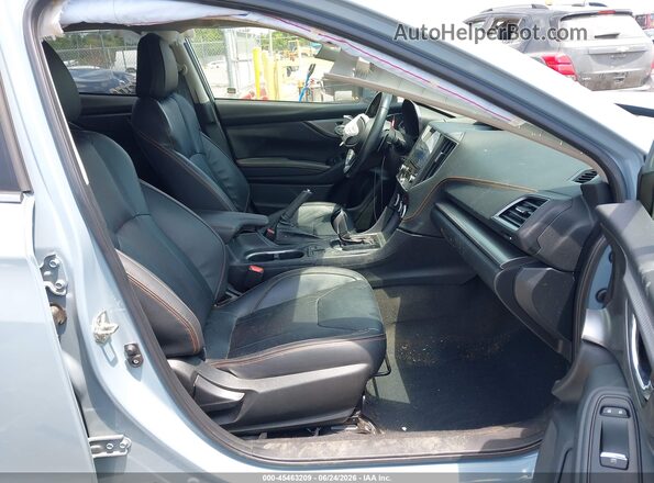 JF2GTHMC7MH203744 2021 SUBARU CROSSTREK Light Blue Вид салона спереди