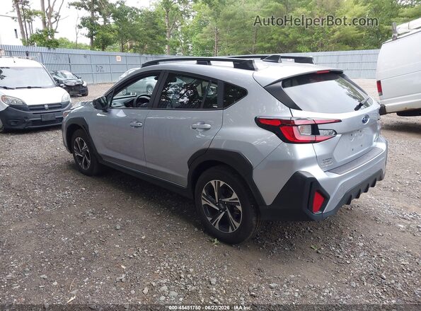 JF2GUHDC6SH226085 2025 SUBARU CROSSTREK Silver Trasero izquierdo