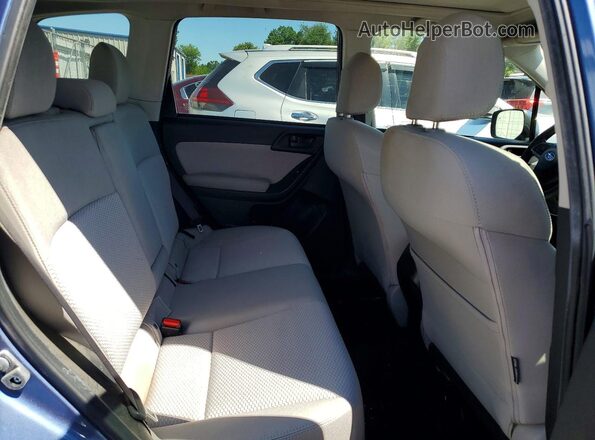 JF2SJADC1GH400906 2016 SUBARU FORESTER Blue Vista interior trasera