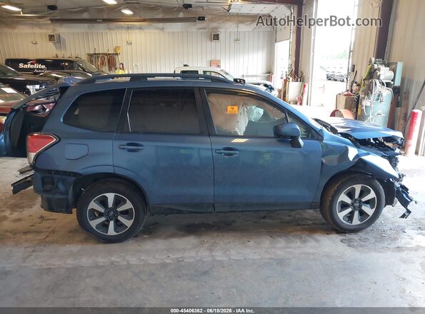 JF2SJAEC2HH518527 2017 SUBARU FORESTER Blue Vista interior trasera