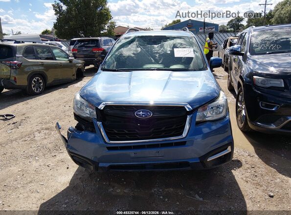 JF2SJAEC8HH401132 2017 SUBARU FORESTER Blue Vista interior trasera