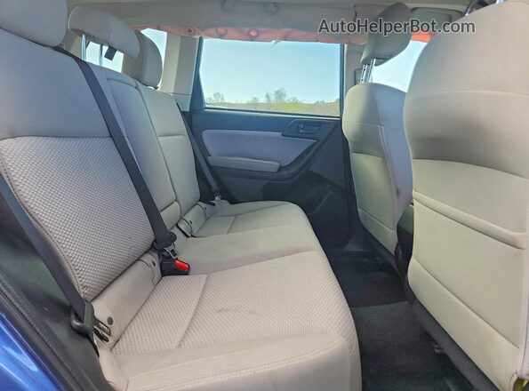 JF2SJAGC7JH473491 2018 SUBARU FORESTER Blue Vista interior trasera