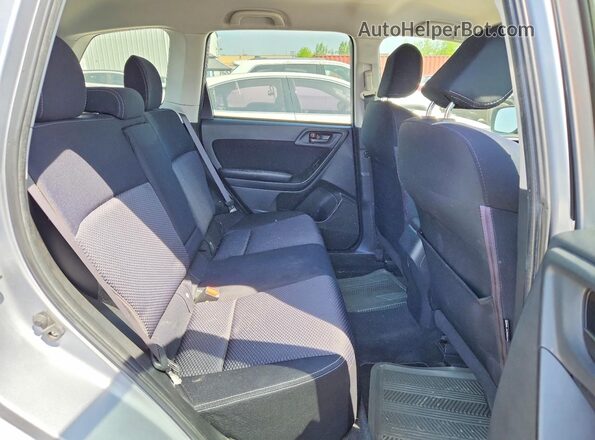 JF2SJCCC8GH450330 2016 SUBARU FORESTER Silver Vista interior trasera