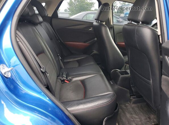 JM1DKBD75G0116092 2016 MAZDA CX-3 Blue Rear seats view