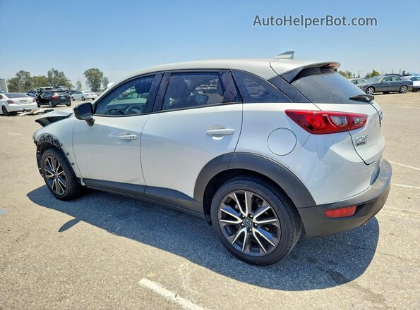 JM1DKDC74J0332391 2018 MAZDA CX-3 Silver Rear left