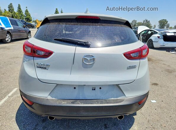 JM1DKDC74J0332391 2018 MAZDA CX-3 Silver Rear view