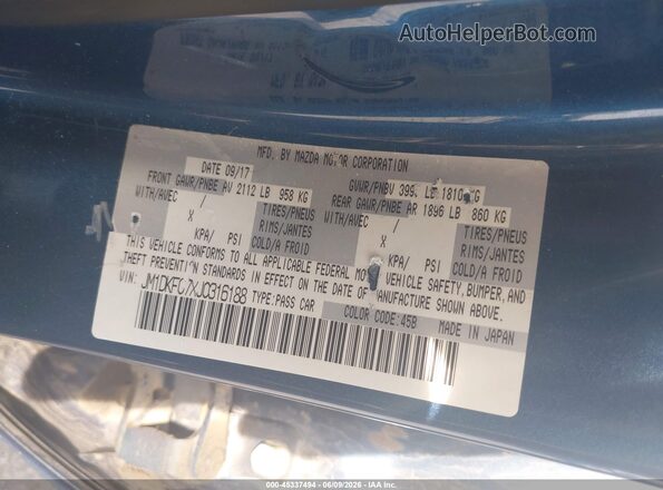 JM1DKFC7XJ0316188 2018 MAZDA CX-3 Blue Vista del compartimento del motor