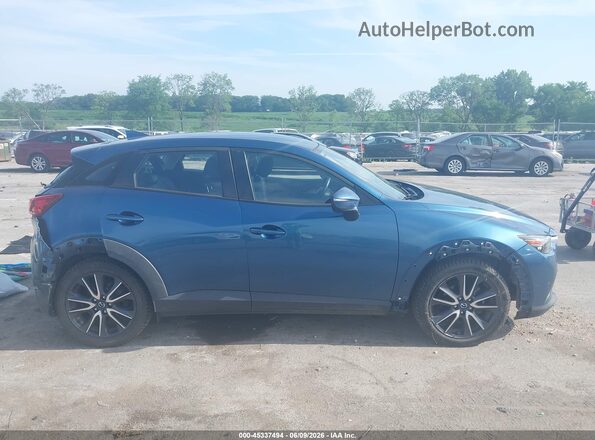 JM1DKFC7XJ0316188 2018 MAZDA CX-3 Blue Vista interior trasera