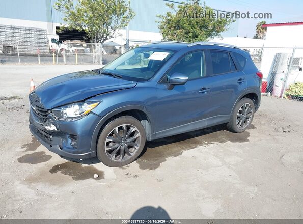 JM3KE2DY9G0856498 2016 MAZDA CX-5 Light Blue Vista tres cuartos delantera izquierda