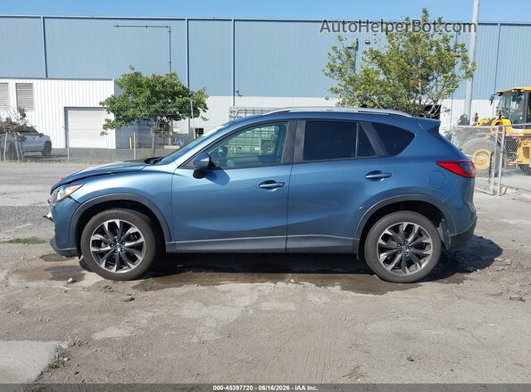 JM3KE2DY9G0856498 2016 MAZDA CX-5 Light Blue Vista interior trasera