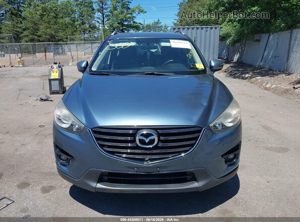 JM3KE4DY6G0777253 2016 MAZDA CX-5 Blue ხელსაწყოთა პანელის ხედი