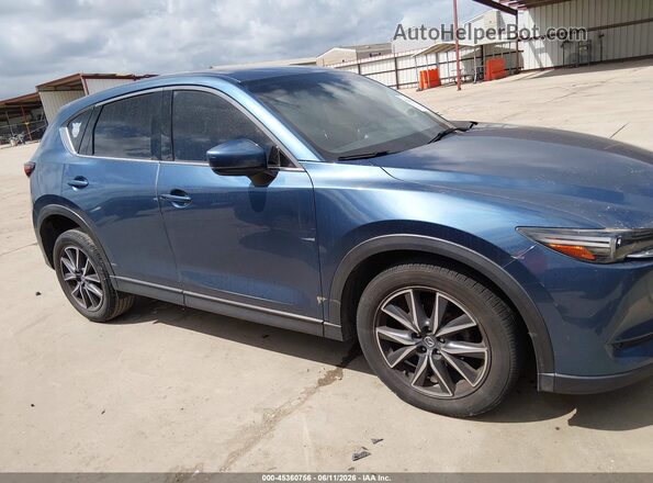 JM3KFADM2J0316633 2018 MAZDA CX-5 Blue Rear interior view