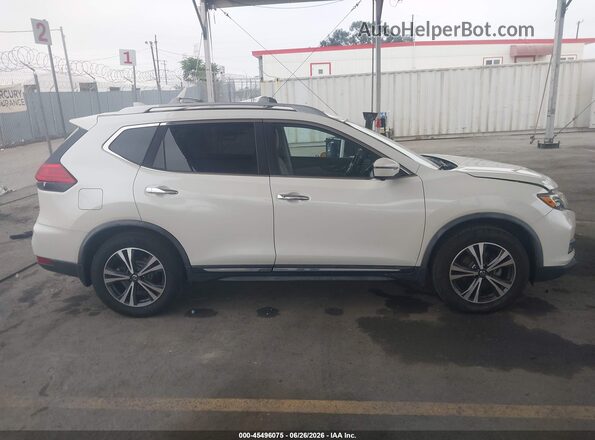 JN8AT2MT5HW403576 2017 NISSAN ROGUE Cream Rear interior view