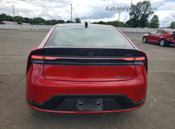 JTDACACU0R3018302 2024 TOYOTA PRIUS Red Rear view