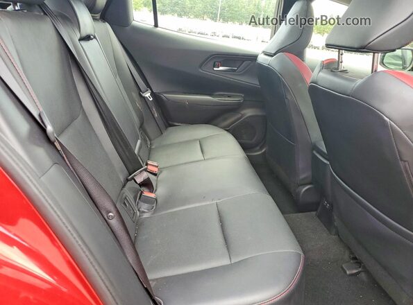 JTDACACU0R3018302 2024 TOYOTA PRIUS Red Rear seats view