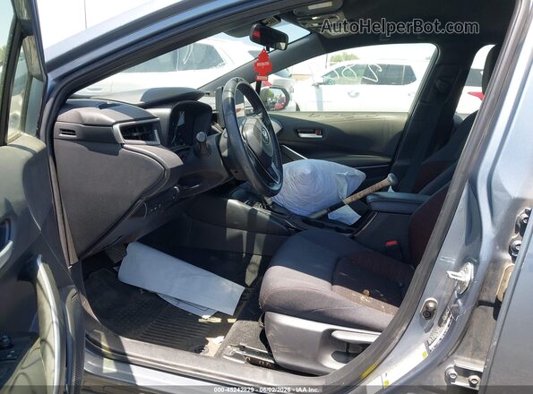 JTDBCMFE1R3034499 2024 TOYOTA COROLLA Light Blue Front interior view