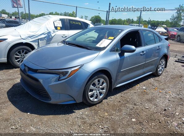 JTDBCMFE3S3069373 2025 TOYOTA COROLLA Light Blue Vista tres cuartos delantera izquierda