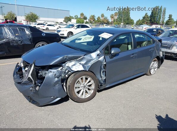 JTDBCMFE5T3142082 2026 TOYOTA COROLLA HYBRID Light Blue Vista tres cuartos delantera izquierda