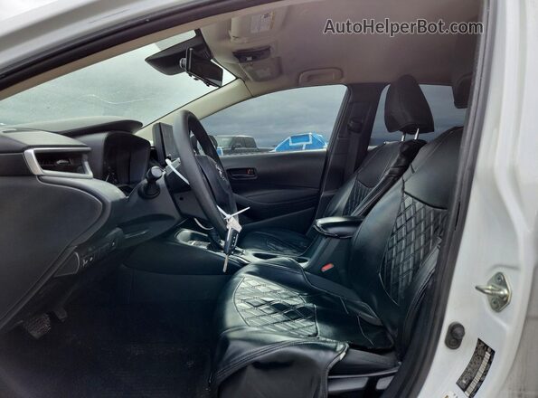 JTDBCMFE9PJ006023 2023 TOYOTA COROLLA Белый Вид салона спереди