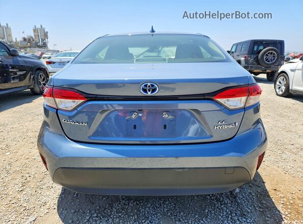 JTDBCMFEXR3028944 2024 TOYOTA COROLLA Silver Rear view