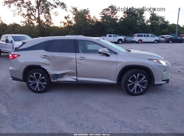 JTJDZKCA9J2012707 2018 LEXUS RX 350L Gold Vista interior trasera