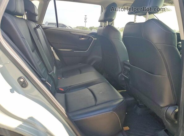 JTMA1RFV2MD074771 2021 TOYOTA RAV4 Silver Вид задньої частини салону