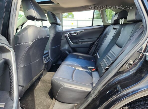 JTMA1RFV4KD516463 2019 TOYOTA RAV4 Black Vista interior trasera