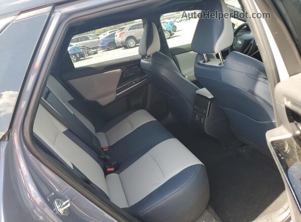 JTMABABA8PA018647 2023 SUBARU SOLTERRA Blue Widok wnętrza z tyłu