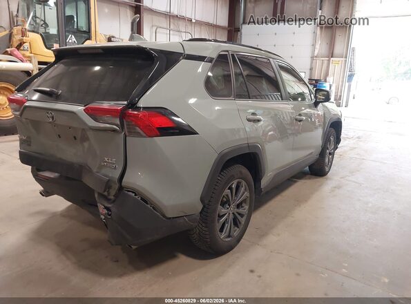 JTMB6RFV0PD110581 2023 TOYOTA RAV4 HYBRID Light Blue Trasero izquierdo