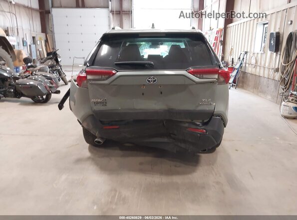 JTMB6RFV0PD110581 2023 TOYOTA RAV4 HYBRID Light Blue Vista interior trasera