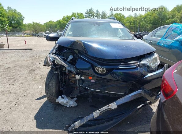 JTMBFREV4HJ145323 2017 TOYOTA RAV4 Dark Blue Vista interior trasera