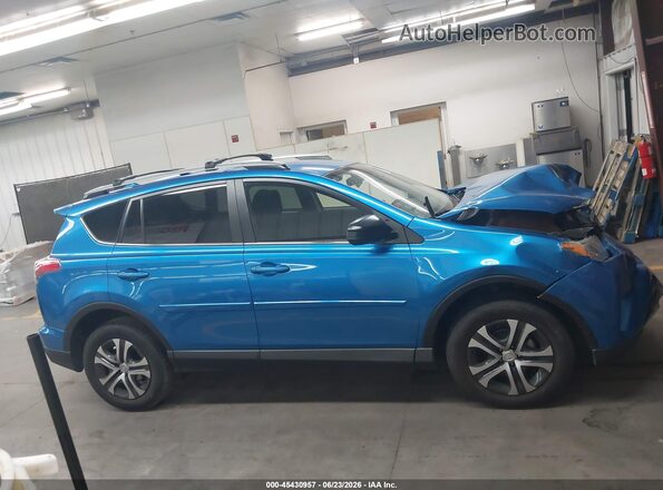 JTMBFREV5JJ717747 2018 TOYOTA RAV4 Blue Rear interior view